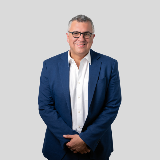 Portrait of Tonino Mavuli, Licensed Real Estate Broker.